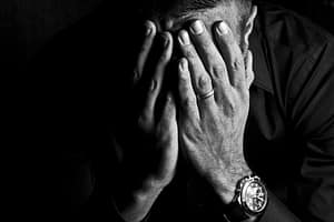 Sad man very dark background