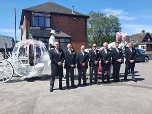 Horses with funeral director team