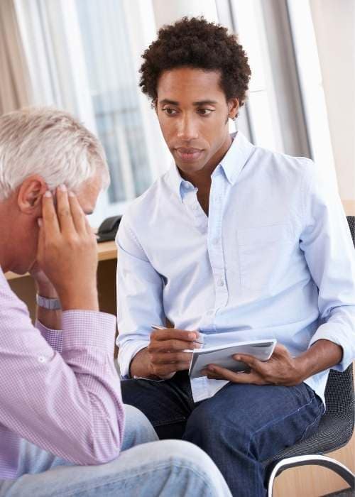 Man with male counsellor