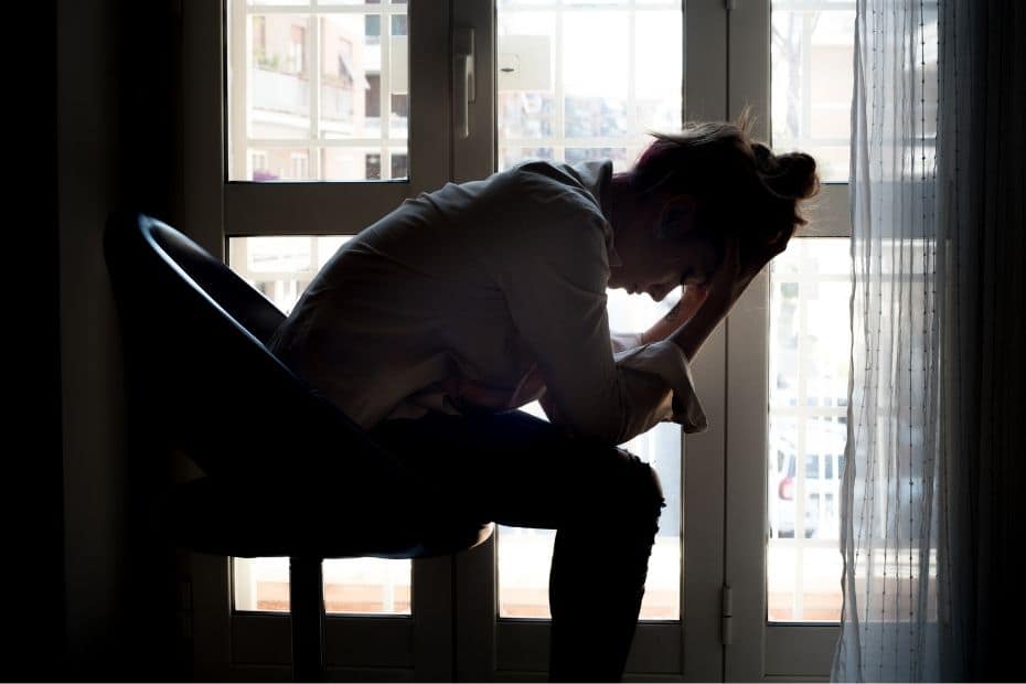 Lady sitting in a chair upset
