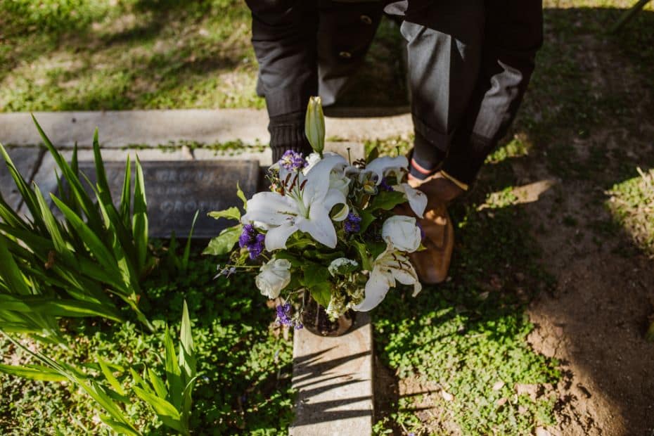 Laying flowers at a grave