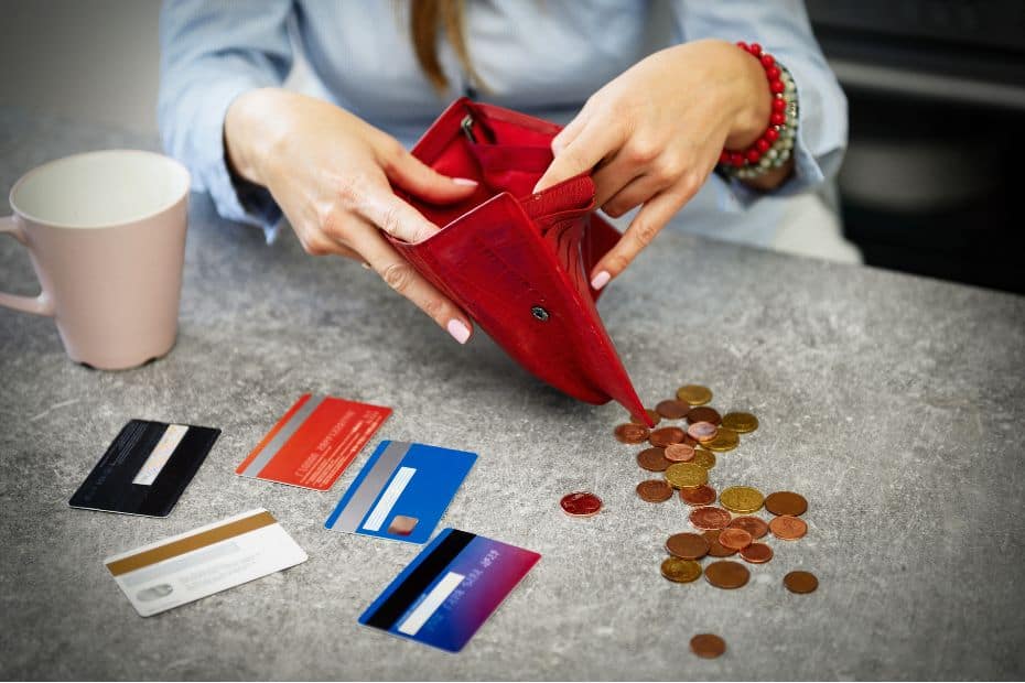 Person looking through purse with no money